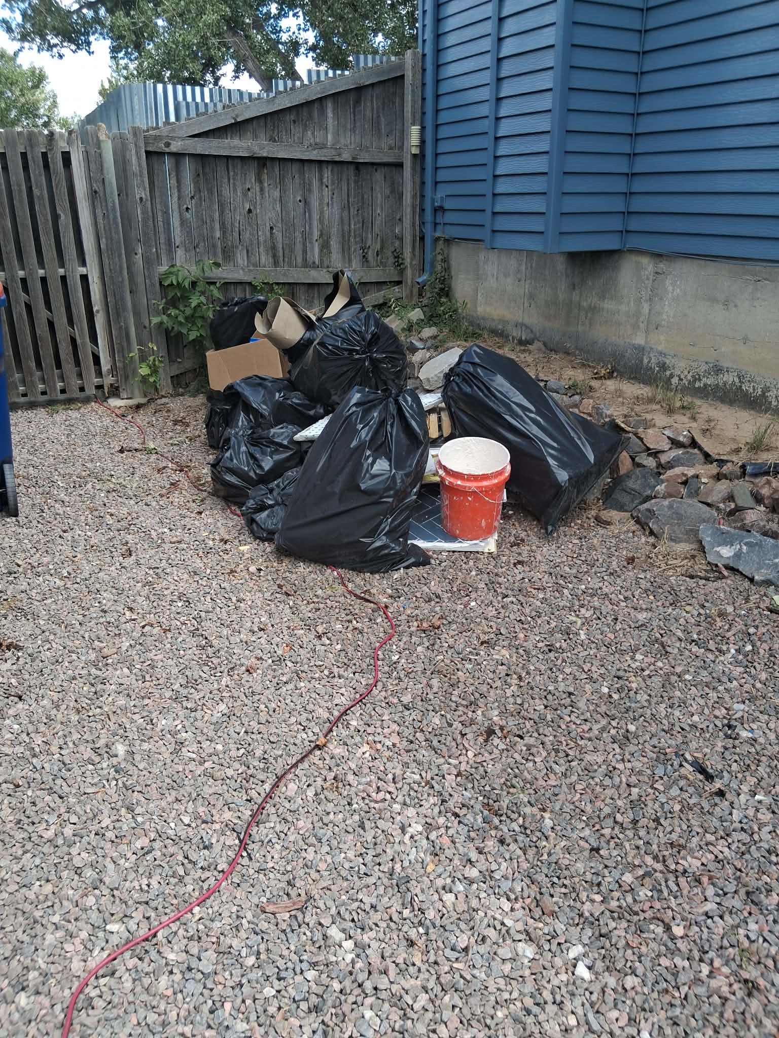 Before: Bagged debris and rock, gone in one visit